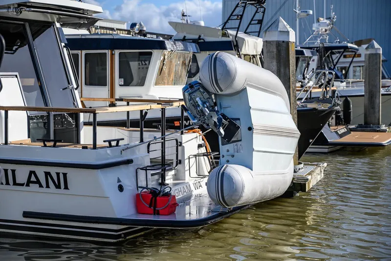 Slide: The Image of 2023 Targa 27.2 boat docked with inflatable dinghy attached. - 3