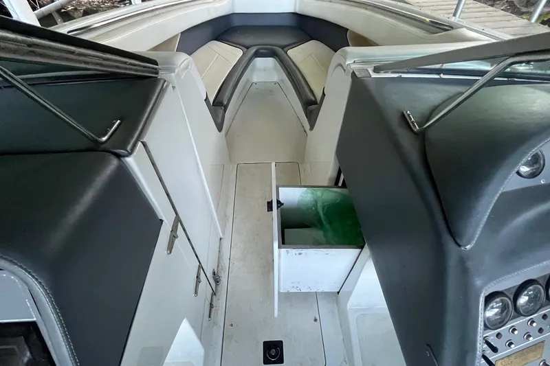 Slide: The Image of Interior of a 1995 Cobalt 252 boat showing seating and storage compartments. - 15
