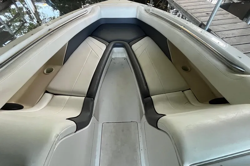 Slide: The Image of Interior of a 1995 Cobalt 252 boat with beige seating and cup holders. - 18
