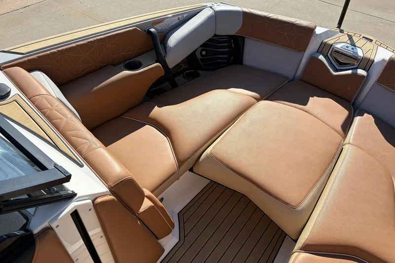 Slide: The Image of Luxurious seating in 2022 Nautique Super Air Nautique G25 Paragon boat interior. - 14