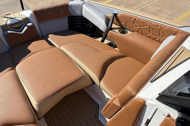 Slide: The Image of Luxurious interior of 2022 Nautique Super Air Nautique G25 Paragon boat with tan leather seating. - 15