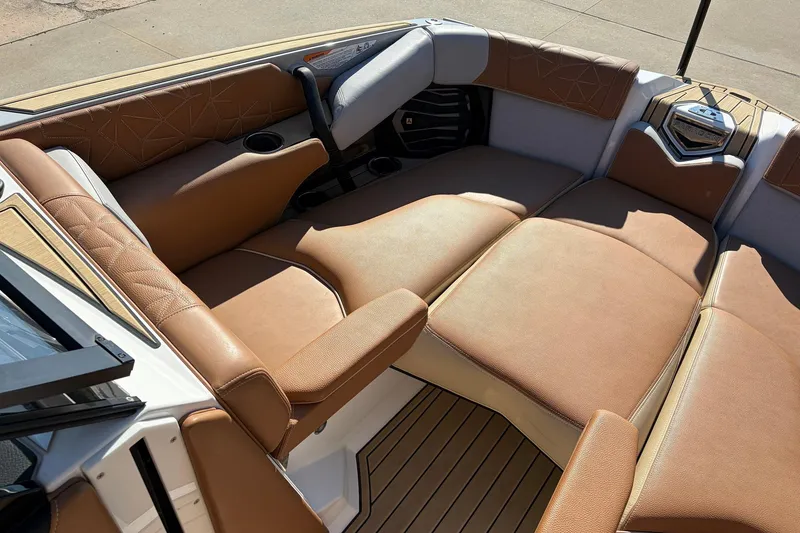 Slide: The Image of Luxurious seating in 2022 Nautique Super Air Nautique G25 Paragon boat interior. - 16