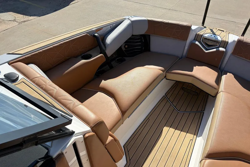 Slide: The Image of 2022 Nautique Super Air Nautique G25 Paragon interior with luxurious tan seating. - 18