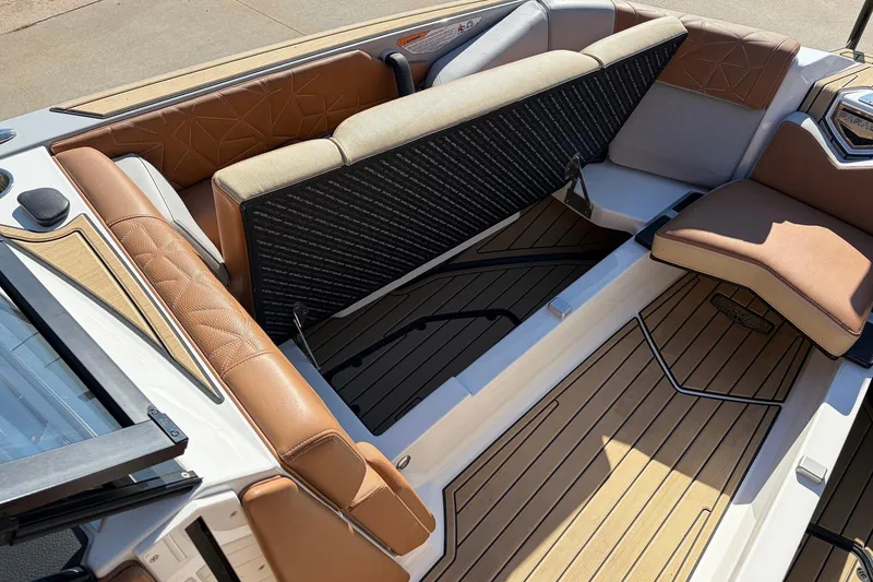 Slide: The Image of 2022 Nautique Super Air Nautique G25 Paragon interior seating and storage area. - 20
