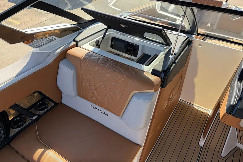 Slide: The Image of 2022 Nautique Super Air Nautique G25 Paragon interior with luxurious seating and storage. - 25
