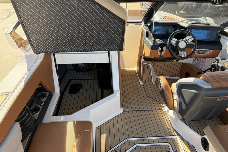 Slide: The Image of 2022 Nautique Super Air Nautique G25 Paragon interior with luxurious seating and modern dashboard. - 29