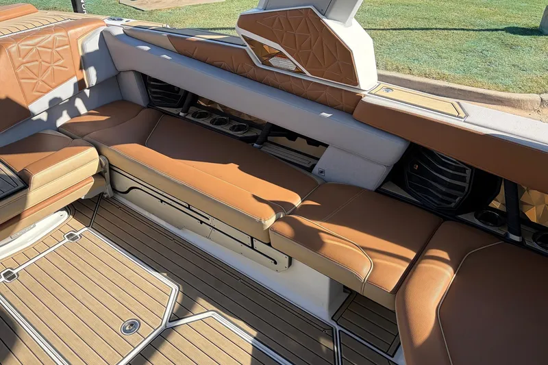 Slide: The Image of Luxurious interior of 2022 Nautique Super Air Nautique G25 Paragon with tan leather seating. - 33