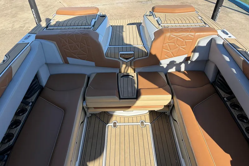 Slide: The Image of 2022 Nautique Super Air Nautique G25 Paragon interior with luxurious tan and white seating. - 38
