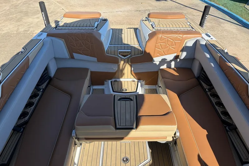 Slide: The Image of 2022 Nautique Super Air Nautique G25 Paragon interior with luxurious tan seating and cup holders. - 40