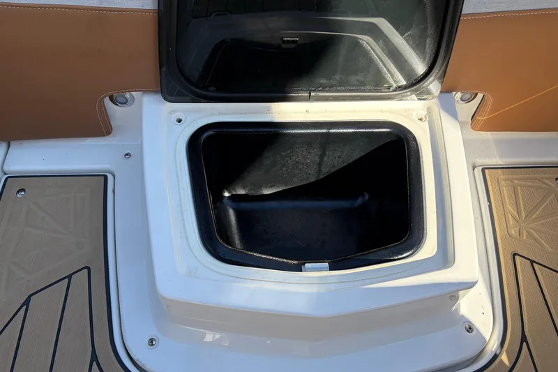 Slide: The Image of Open storage compartment on 2022 Nautique Super Air Nautique G25 Paragon boat. - 46