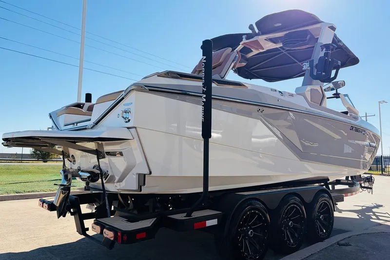 Slide: The Image of 2022 Nautique Super Air Nautique G25 Paragon boat on trailer, side view. - 5