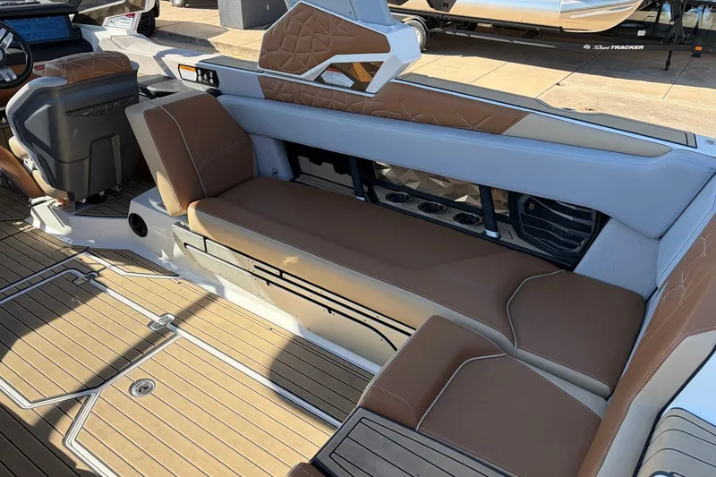 Slide: The Image of 2022 Nautique Super Air Nautique G25 Paragon interior with luxurious seating and teak flooring. - 50