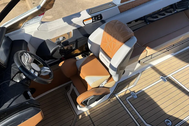 Slide: The Image of 2022 Nautique Super Air Nautique G25 Paragon interior with luxury seating and steering wheel. - 52