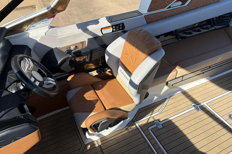 Slide: The Image of 2022 Nautique Super Air Nautique G25 Paragon interior with luxury seating and steering wheel. - 53