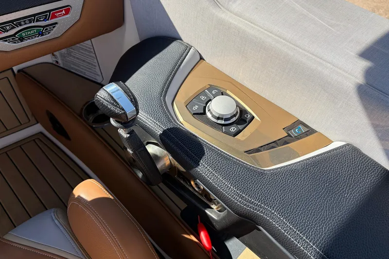 Slide: The Image of 2022 Nautique Super Air Nautique G25 Paragon dashboard with control panel and steering. - 56