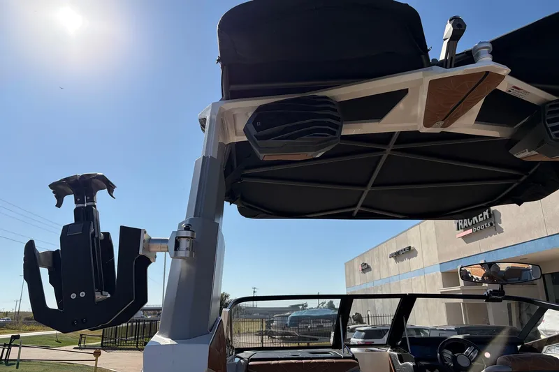 Slide: The Image of 2022 Nautique Super Air Nautique G25 Paragon boat with tower speakers and wakeboard rack. - 58