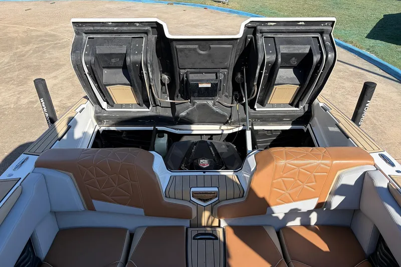 Slide: The Image of 2022 Nautique Super Air Nautique G25 Paragon interior with open engine compartment. - 60