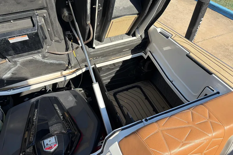 Slide: The Image of 2022 Nautique Super Air Nautique G25 Paragon engine compartment with tan seating detail. - 62