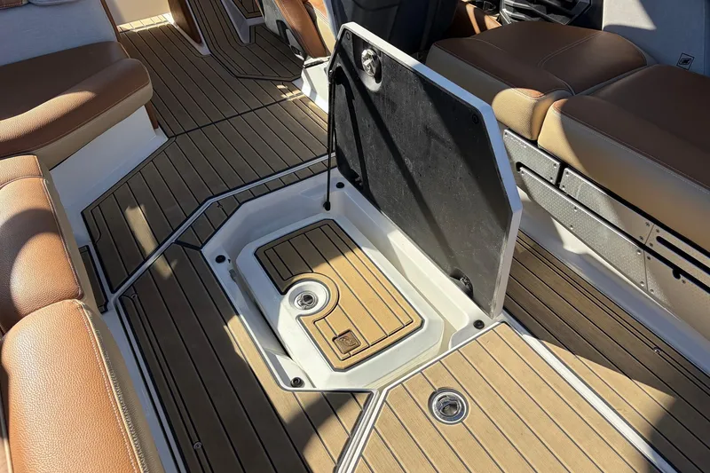 Slide: The Image of 2022 Nautique Super Air Nautique G25 Paragon interior with teak flooring and seating. - 68
