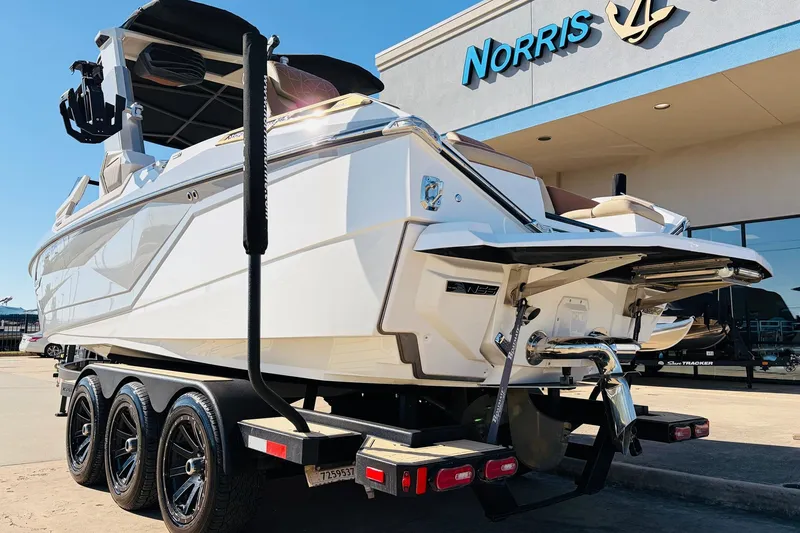 Slide: The Image of 2022 Nautique Super Air Nautique G25 Paragon boat on trailer outside Norris dealership. - 7
