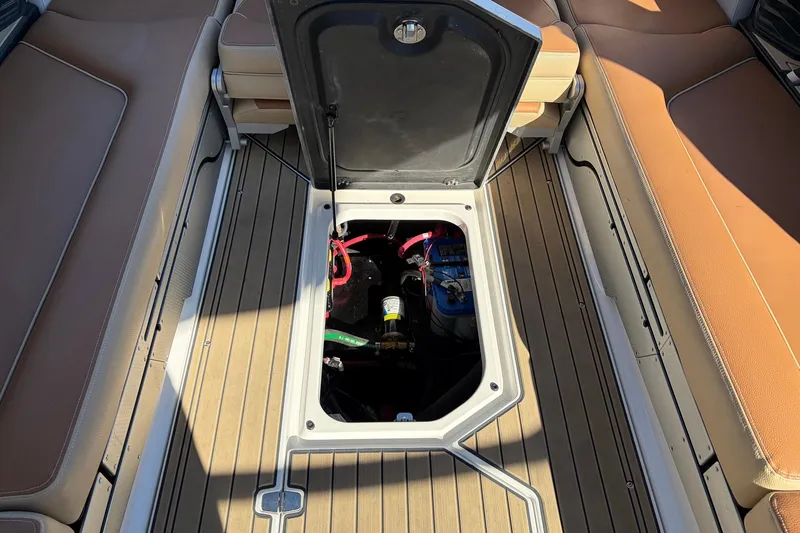 Slide: The Image of 2022 Nautique Super Air Nautique G25 Paragon interior with open storage compartment. - 72