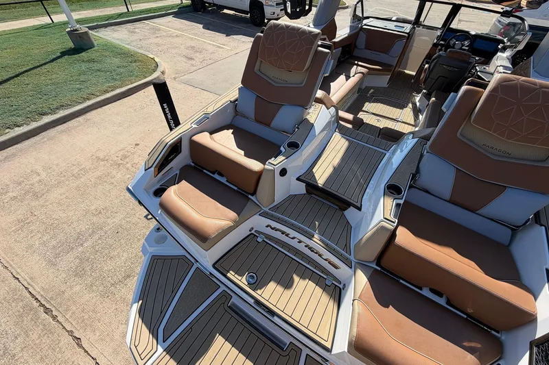 Slide: The Image of 2022 Nautique Super Air Nautique G25 Paragon boat interior with luxurious seating and deck. - 73