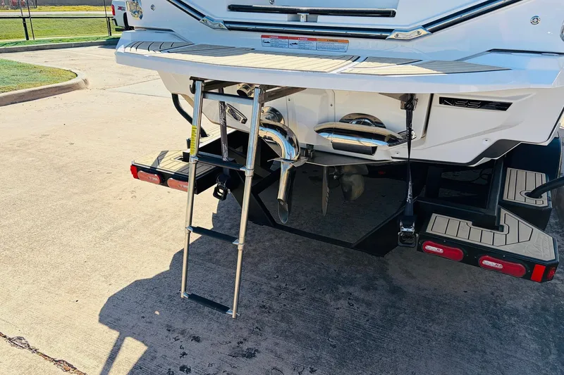 Slide: The Image of 2022 Nautique Super Air Nautique G25 Paragon rear view with swim platform and ladder. - 8