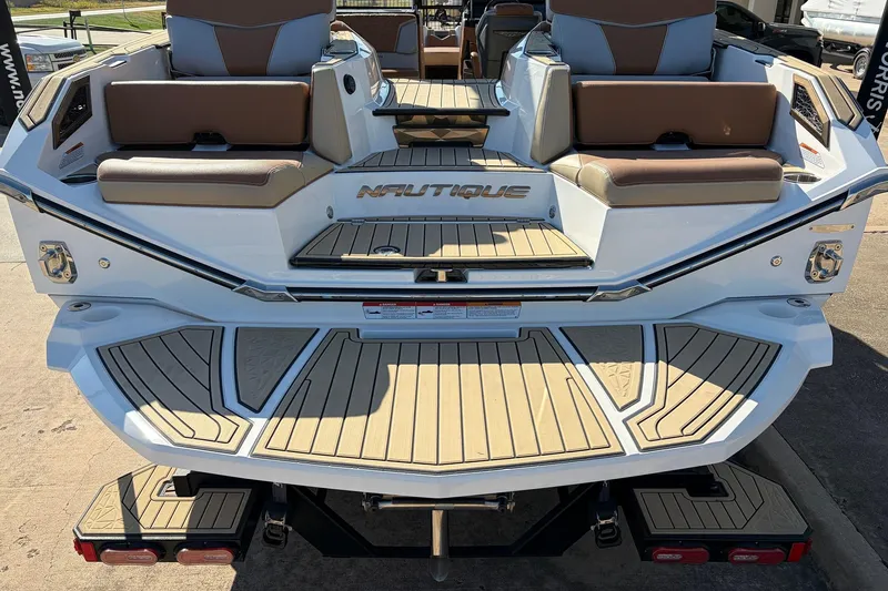 Slide: The Image of 2022 Nautique Super Air Nautique G25 Paragon boat with luxurious seating and teak flooring. - 9