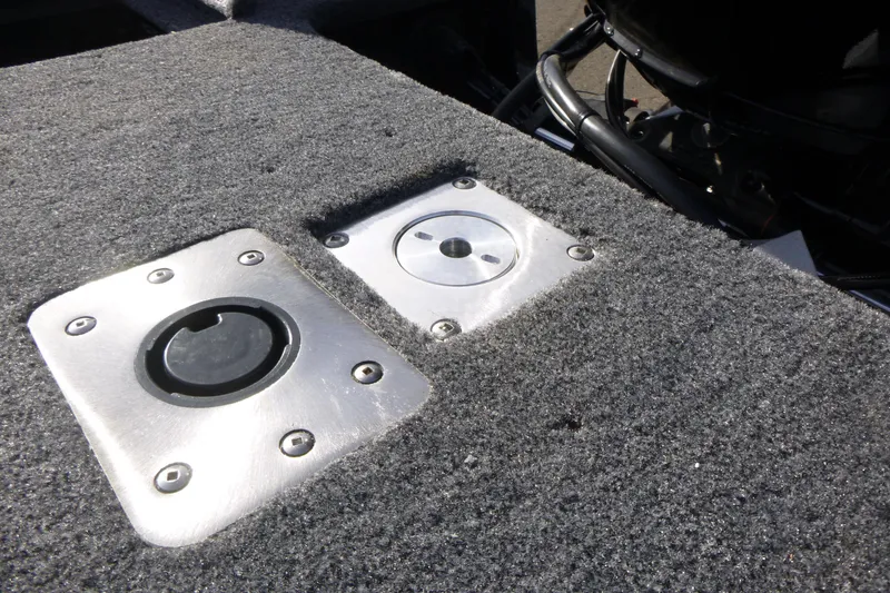 Slide: The Image of 2026 Tracker Targa V-19 Combo boat interior with seating and carpeted deck. - 11