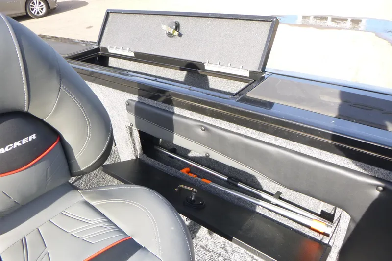 Slide: The Image of 2026 Tracker Targa V-19 Combo boat interior with storage compartment and seating. - 15