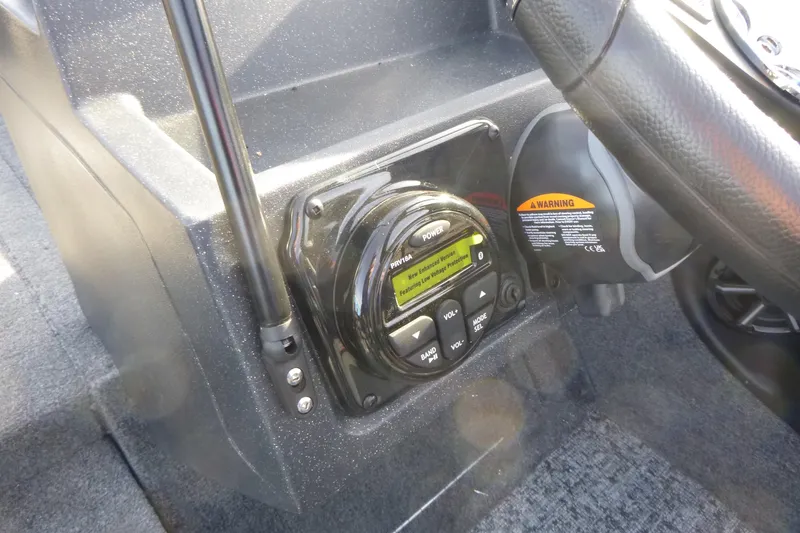 Slide: The Image of Control panel of 2026 Tracker Targa V-19 Combo boat with warning label. - 21