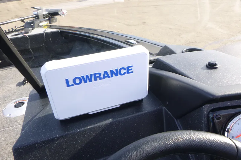 Slide: The Image of 2026 Tracker Targa V-19 Combo boat dashboard with steering wheel and gauges. - 22