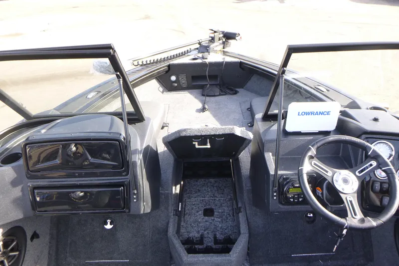 Slide: The Image of 2026 Tracker Targa V-19 Combo boat interior with steering wheel and Lowrance equipment. - 27