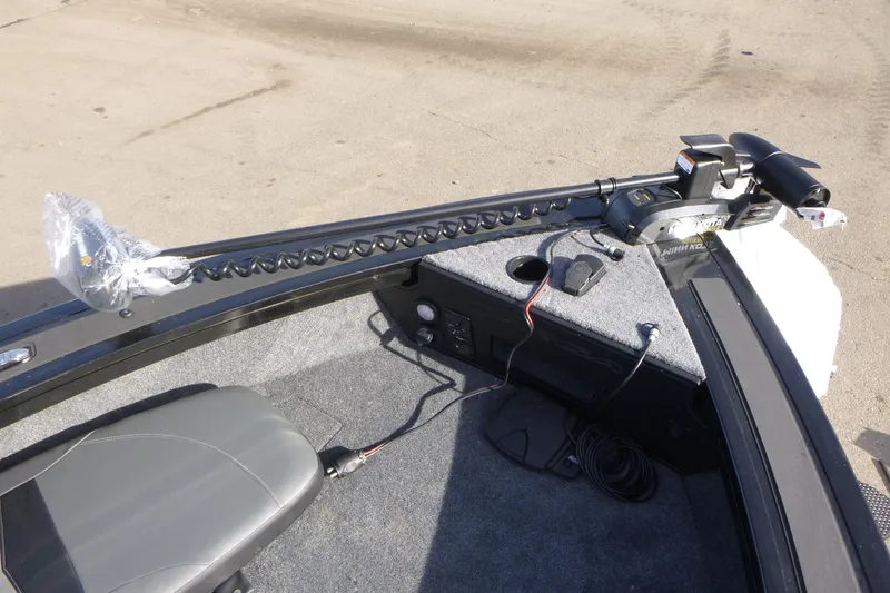 Slide: The Image of 2026 Tracker Targa V-19 Combo boat interior with trolling motor and seating. - 38