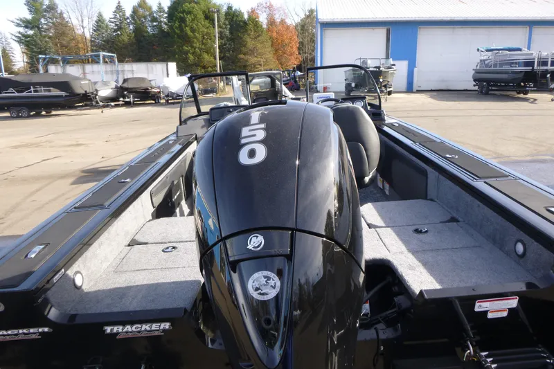 Slide: The Image of 2026 Tracker Targa V-19 Combo boat with powerful 150 HP engine, parked outdoors. - 4