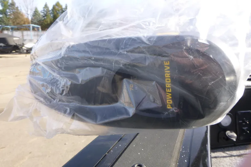 Slide: The Image of 2026 Tracker Targa V-19 Combo boat storage compartment with cup holders and gear. - 41