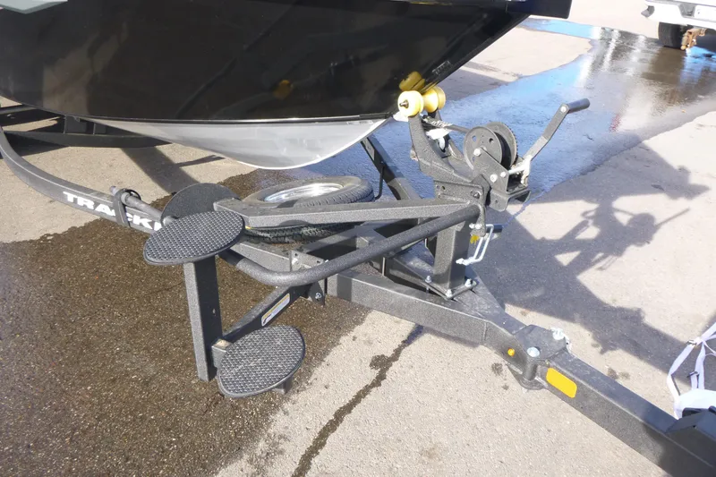 Slide: The Image of 2026 Tracker Targa V-19 Combo boat interior with storage compartments and seating. - 43