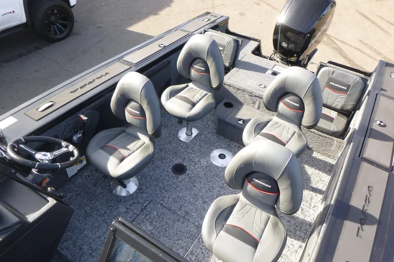 Slide: The Image of 2026 Tracker Targa V-19 Combo boat interior with gray seating and steering wheel. - 7