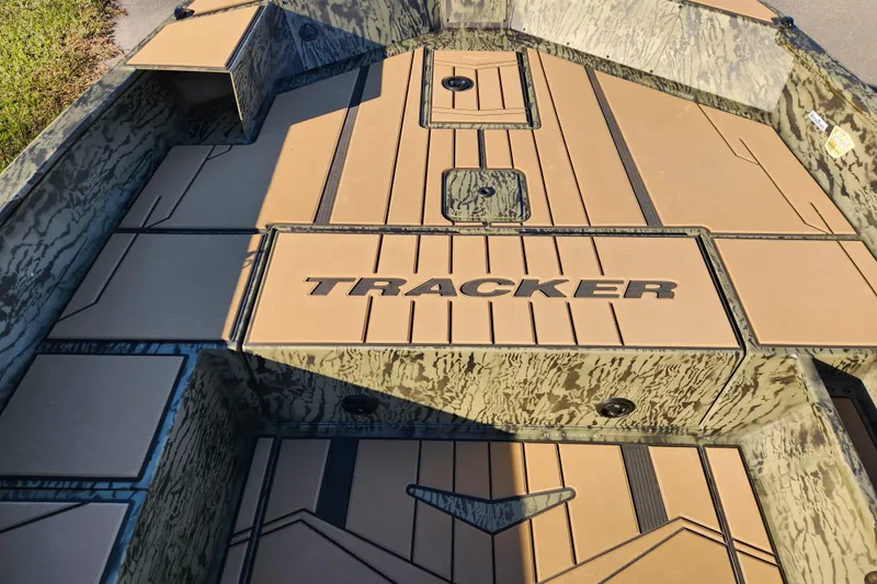 Slide: The Image of 2026 Tracker Grizzly 1756 T Marsh boat interior with camo design and logo. - 15