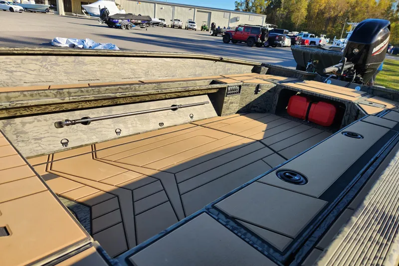 Slide: The Image of 2026 Tracker Grizzly 1756 T Marsh boat interior with spacious deck and storage compartments. - 8