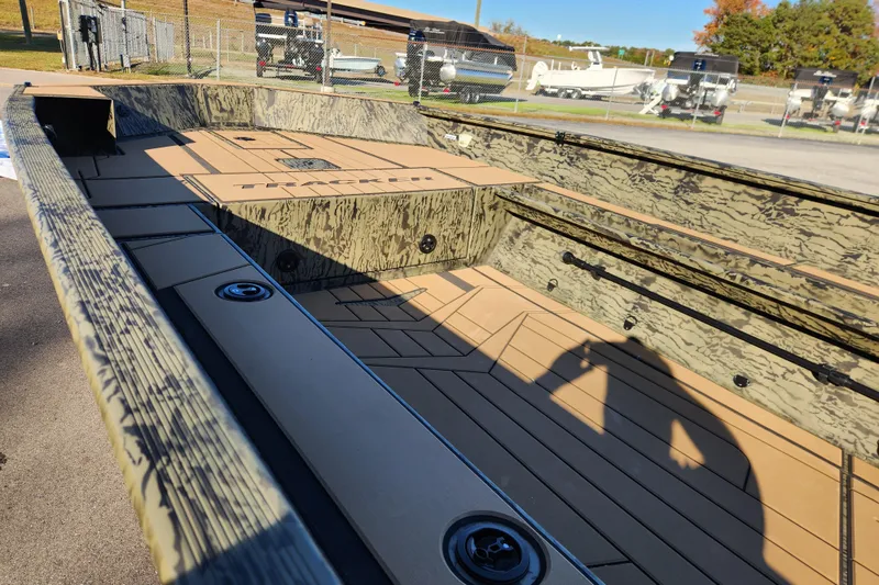 Slide: The Image of 2026 Tracker Grizzly 1756 T Marsh boat interior with camouflage design and spacious deck. - 9