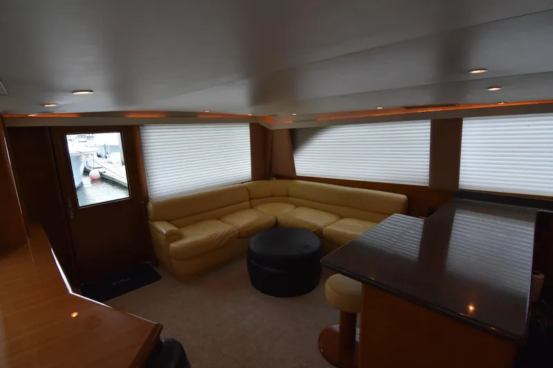 Slide: The Image of Luxurious interior of 1999 Viking 58 Convertible yacht with leather seating and modern decor. - 11
