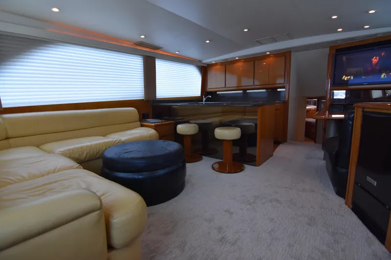 Slide: The Image of Luxurious interior of a 1999 Viking 58 Convertible yacht with leather seating and modern amenities. - 13