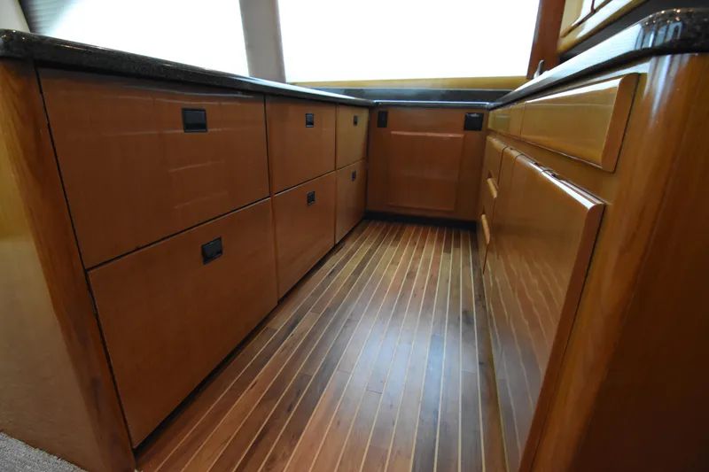 Slide: The Image of Luxurious wooden cabinetry in 1999 Viking 58 Convertible yacht interior. - 18