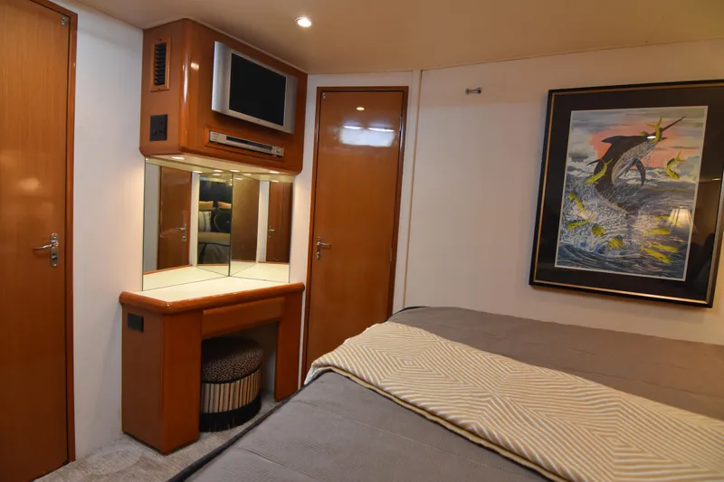 Slide: The Image of Luxurious interior of 1999 Viking 58 Convertible yacht with elegant decor and artwork. - 22