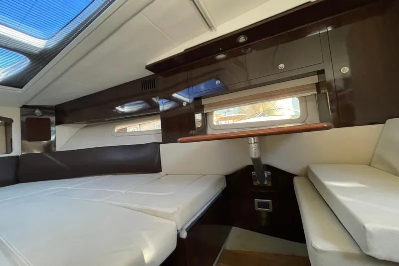 Slide: The Image of Interior cabin of 2016 Sea Ray 310 Sundancer with sleek design and comfortable seating. - 11