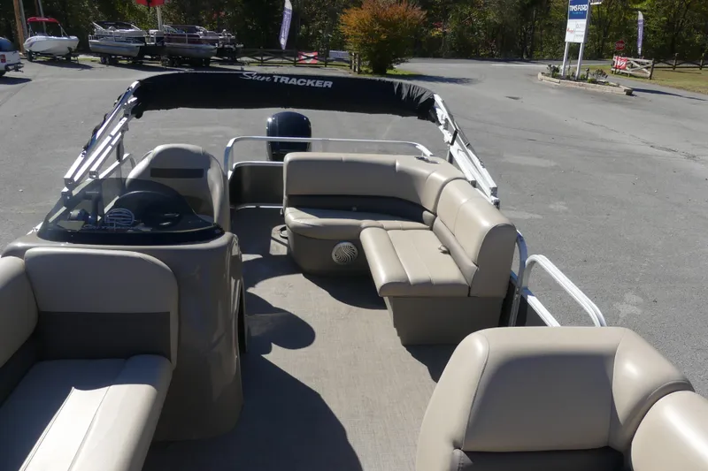 Slide: The Image of 2023 Sun Tracker Party Barge 18 DLX pontoon boat with beige seating and spacious deck. - 4