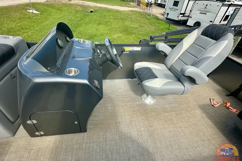 Slide: The Image of 2024 Massimo P-21R pontoon boat interior with plush seating and modern steering console. - 12