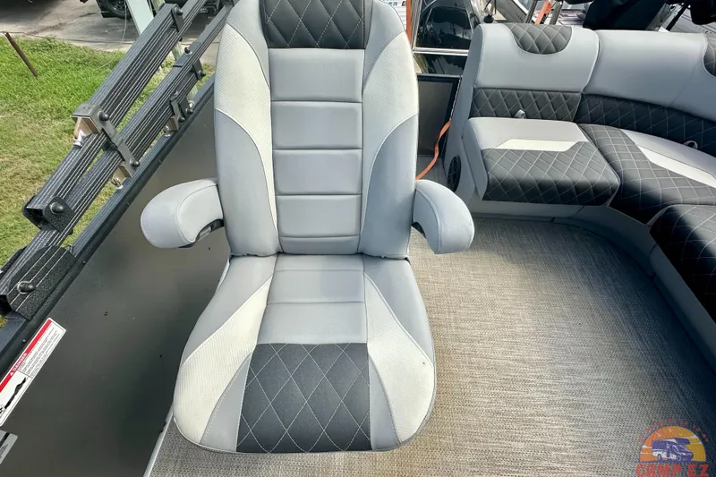 Slide: The Image of Luxurious seating on 2024 Massimo P-21R boat, featuring quilted upholstery and integrated speakers. - 15