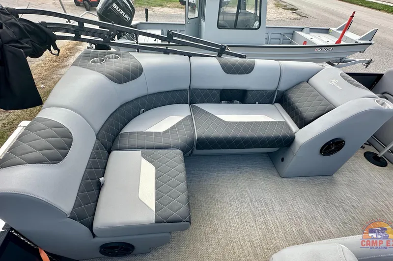 Slide: The Image of Luxurious interior of 2024 Massimo P-21R pontoon boat with plush seating and modern steering console. - 19